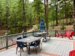 Large Deck with Tables and Sitting Areas Overlooking Forest
